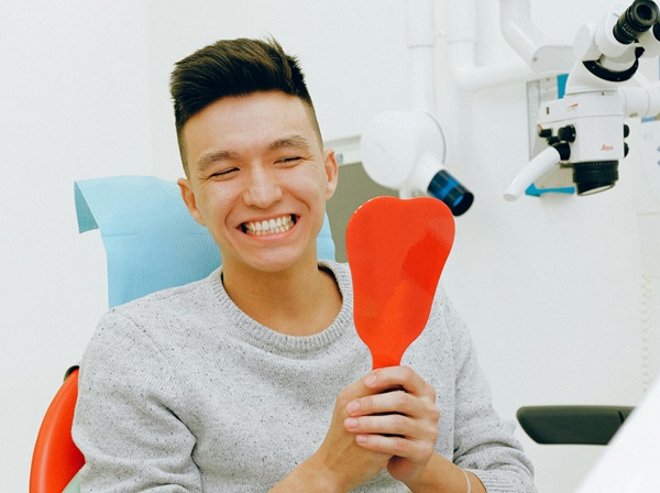 Smiling patient with dentist